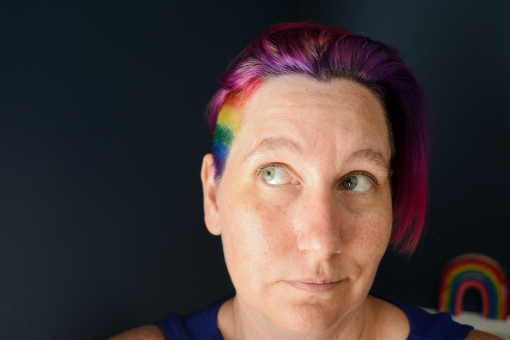 The author looking whimsical with rainbow hair